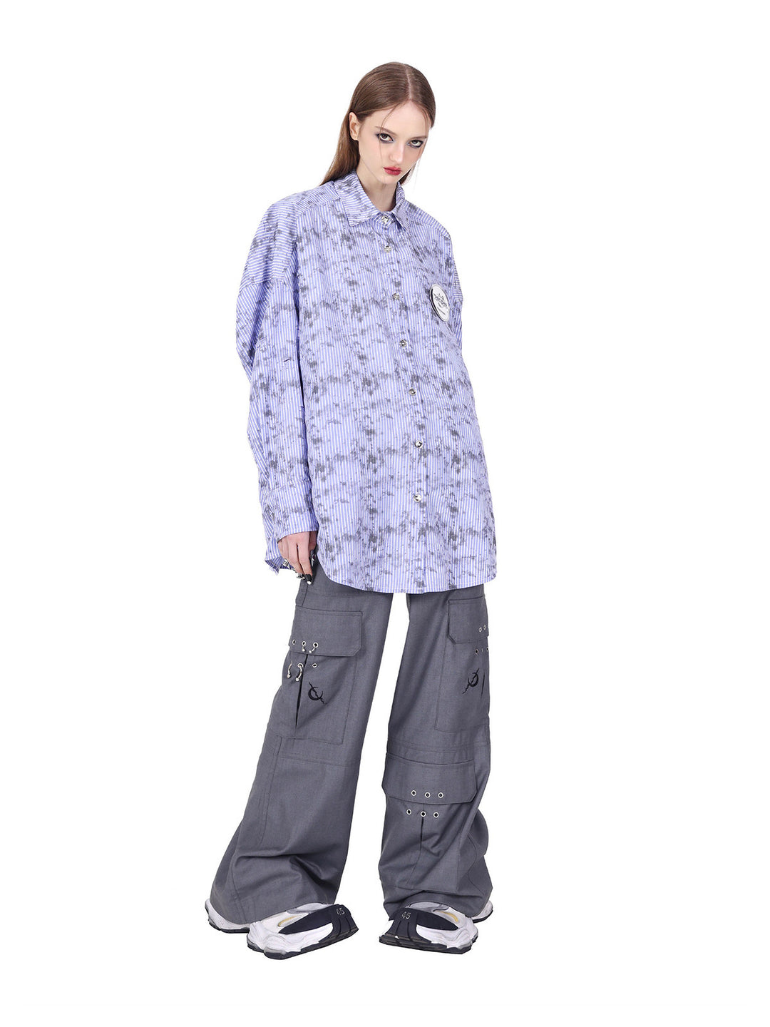 PINKSPINK ELECTRIC MOON ring-detail cargo flare trousers in gray — closer angled front view of the staggered cargo pockets