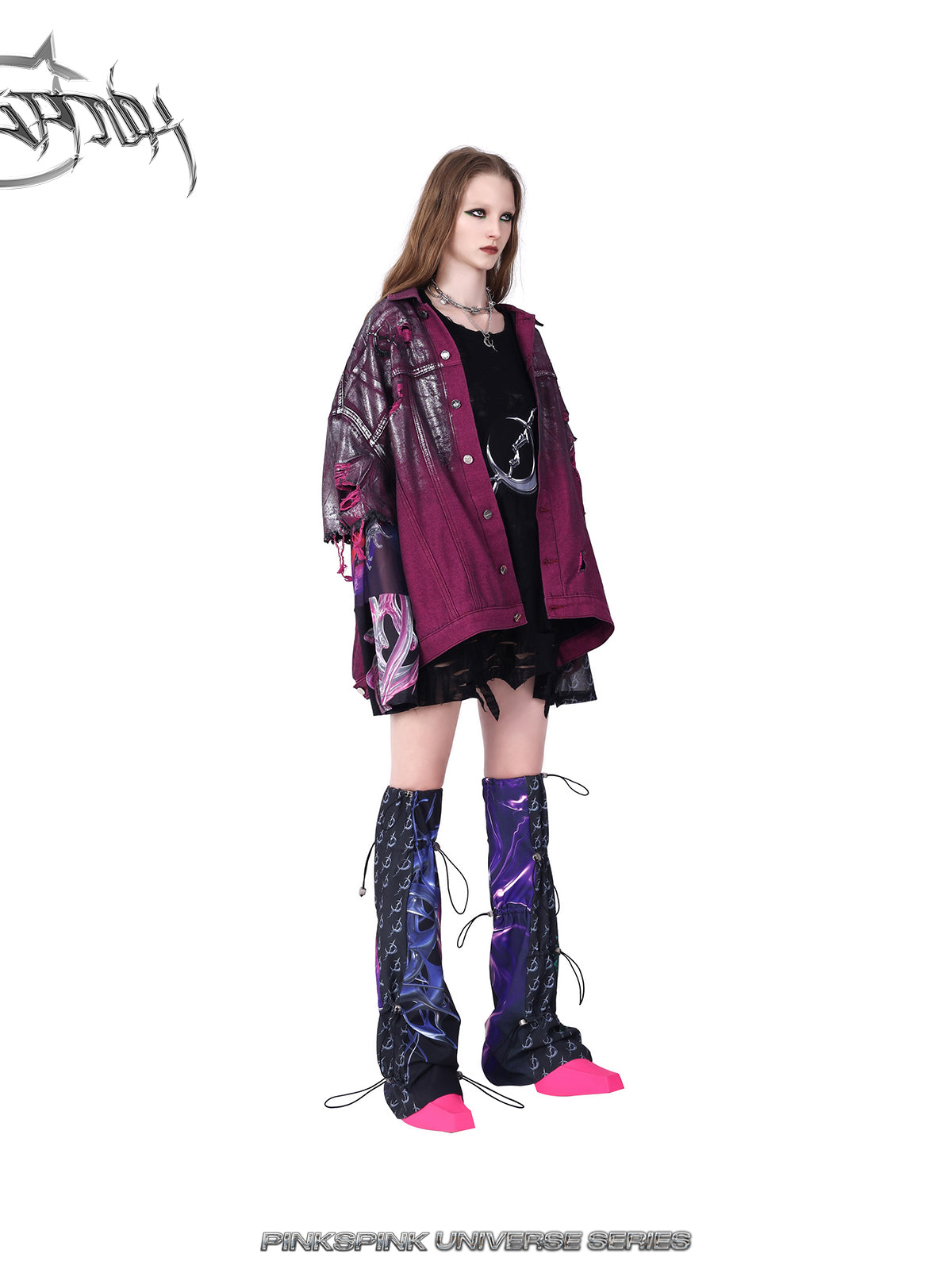PINKSPINK silver-coated distressed denim jacket in WASTELAND PINK — three-quarter view styled over a black top and shorts.