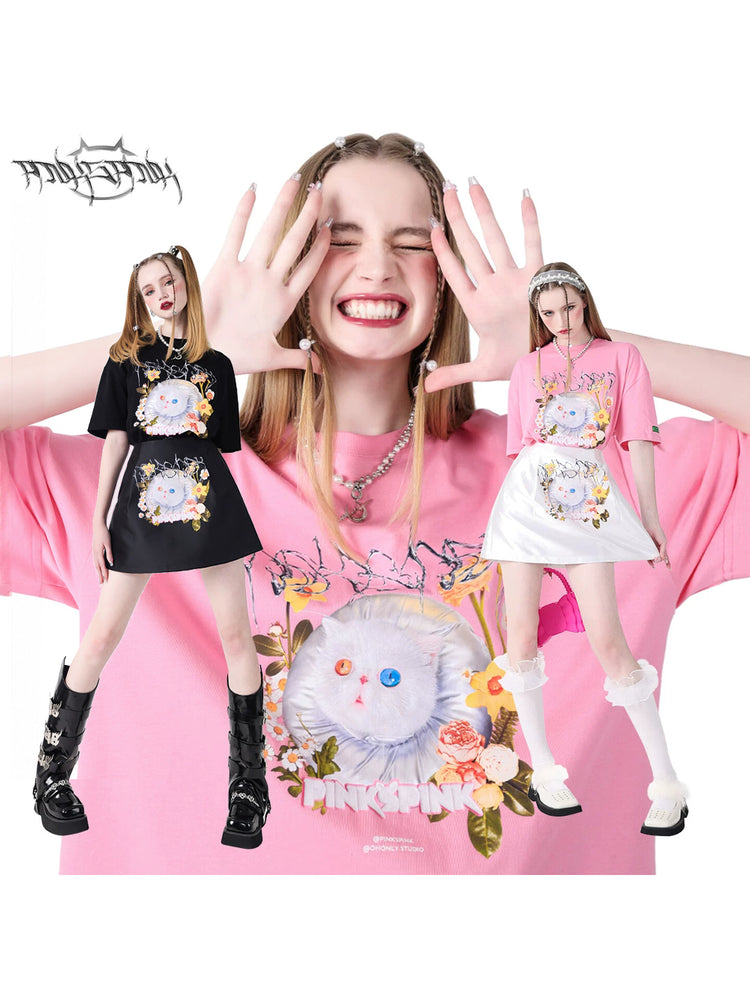 PINKSPINK GARFIELD oversized graphic tee — black and pink modeled collage showing the cat-and-flower graphic