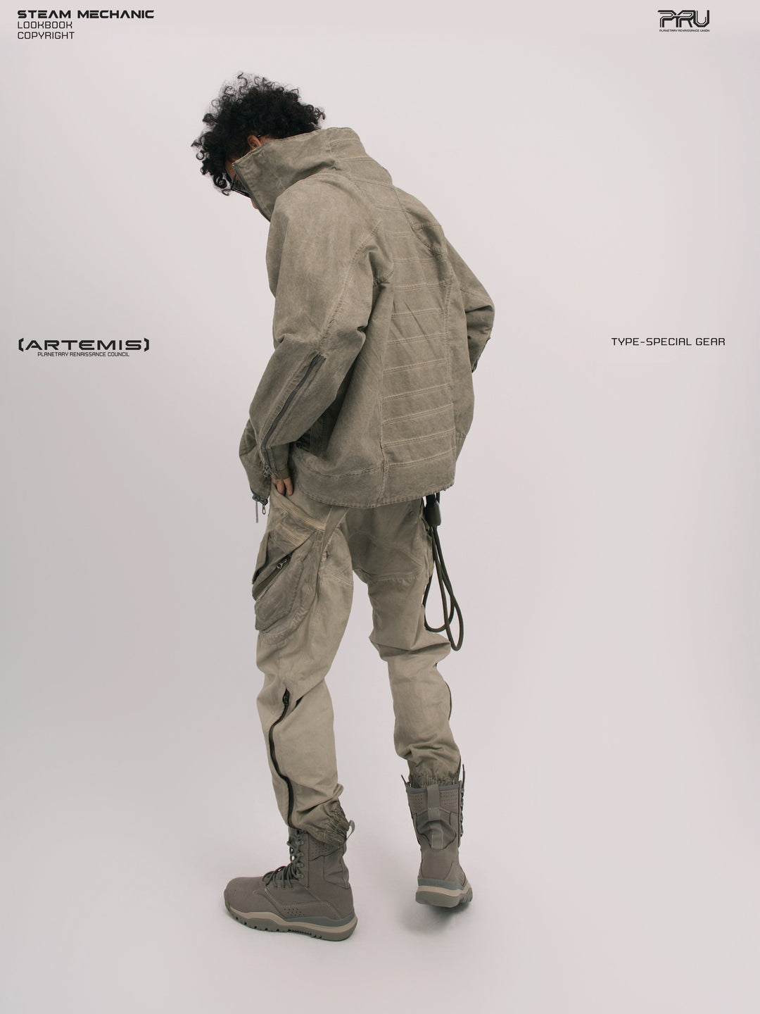 ARTEMIS tuck-paneled technical jacket — rear three-quarter modeled view showing tucked back panels