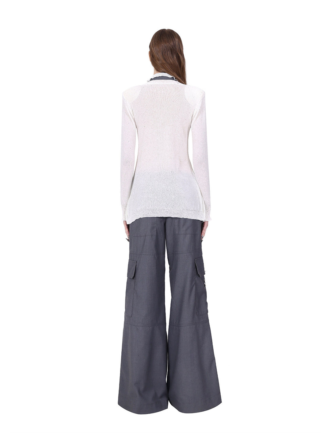 PINKSPINK ELECTRIC MOON ring-fastened sequin knit shirt in white — full-length back view styled with gray cargo trousers