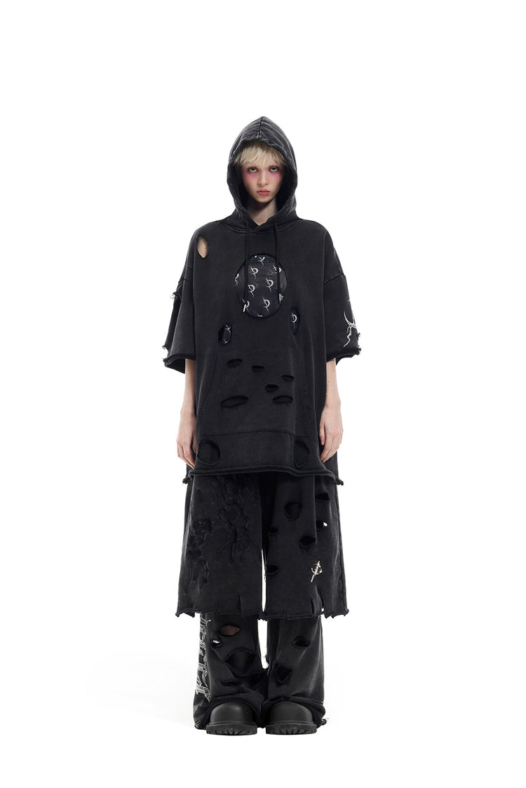 PINKSPINK ELECTRIC MOON distressed embroidered wide-leg shorts — black — full-length front view with hooded layering