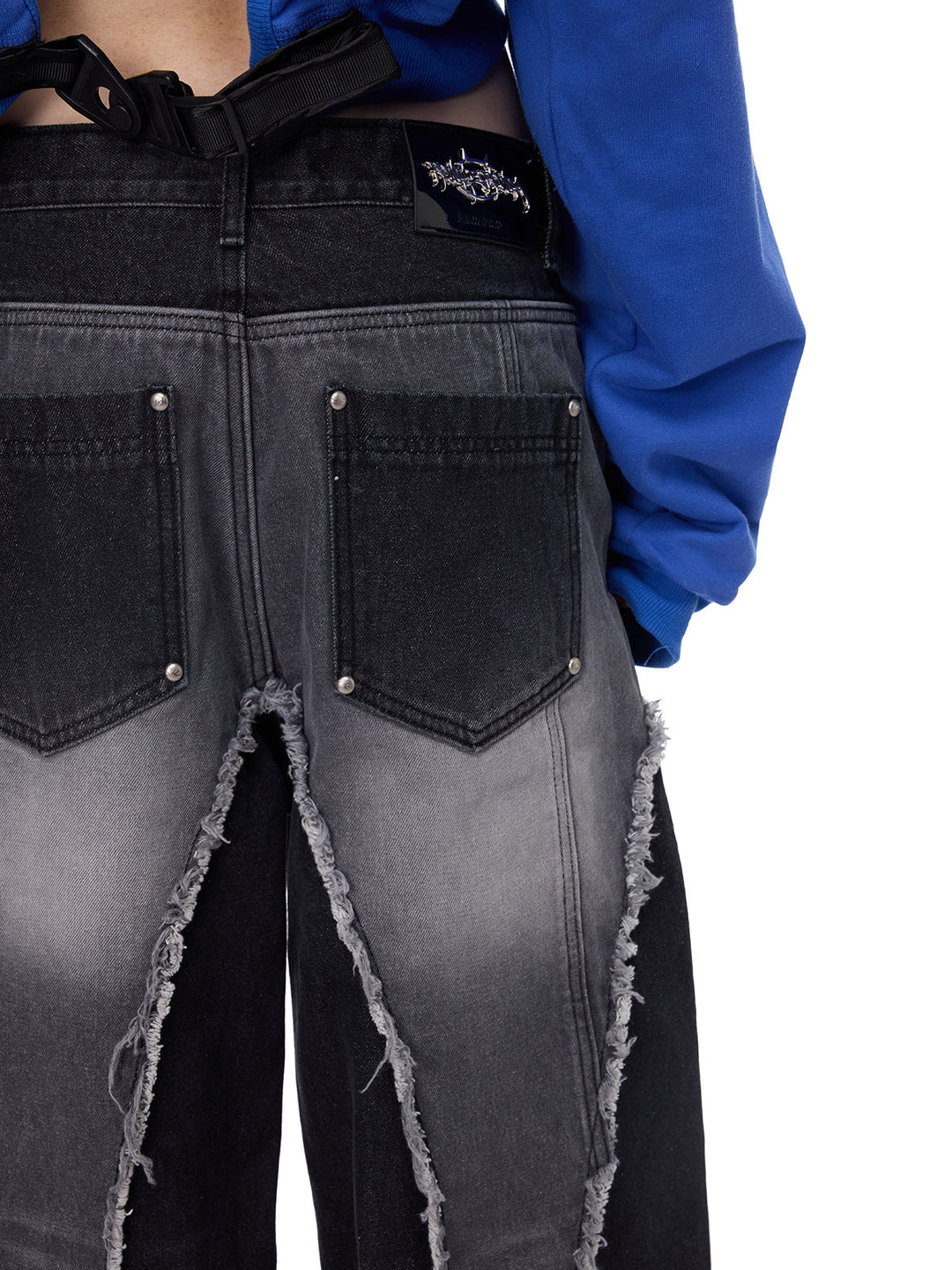 PINKSPINK ELECTRIC MOON reconstructed wide-leg jeans — back pocket and reconstructed seam close-up