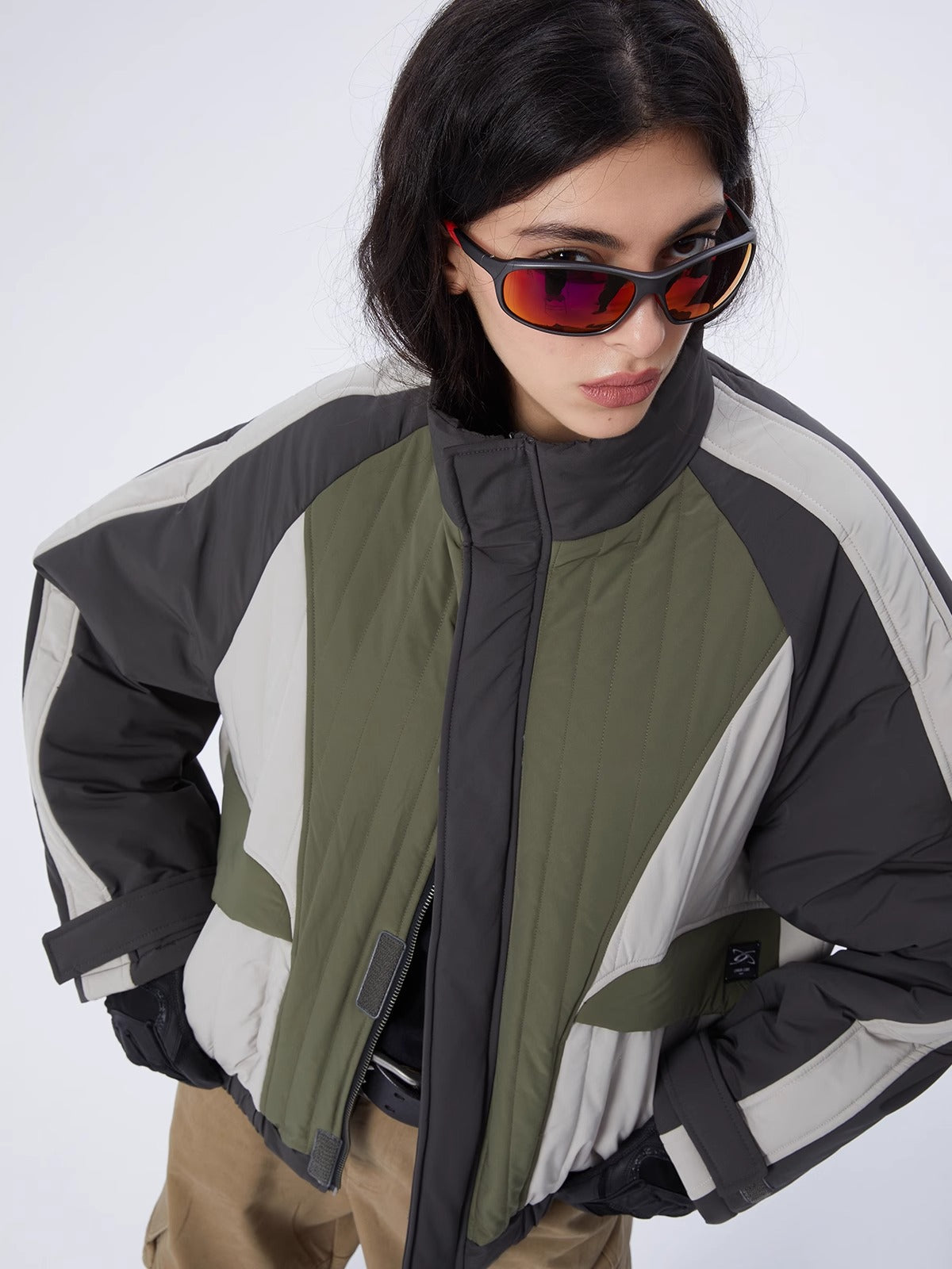 ERRORCODE ROBOT gray, white and green colorblock quilted cropped jacket, close-up modeled view showing the collar and geometric panels