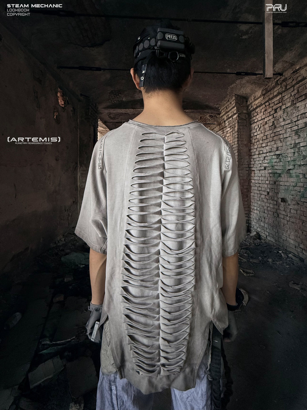 ERODED SPINE distressed asymmetric tee in oxidized white — straight back modeled view showing the full spine cutout structure