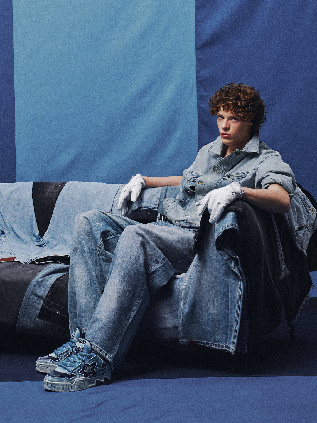STARTER VOL 90S Denim Blue platform sneakers worn with a denim outfit, upright seated front view