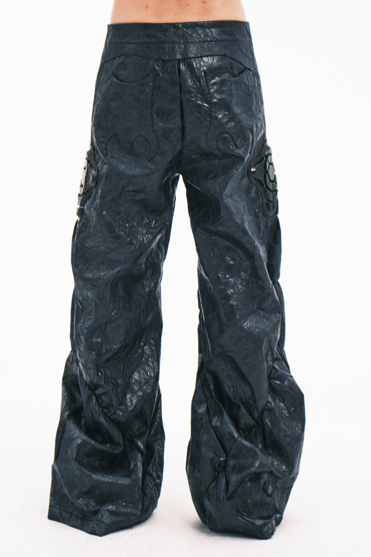 EMBRYO GUARD SHELL ruched PU leather flare pants — garment-only construction view