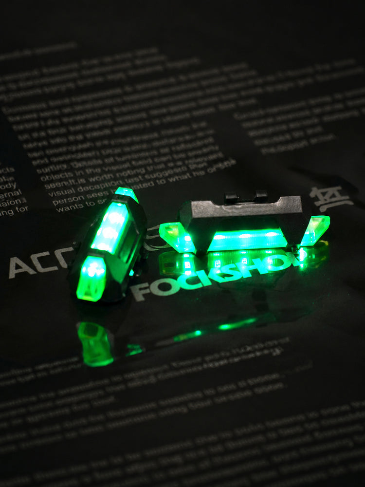 FOCKSHOP TRAIN L rechargeable costume light pair — green pair viewed from an oblique angle