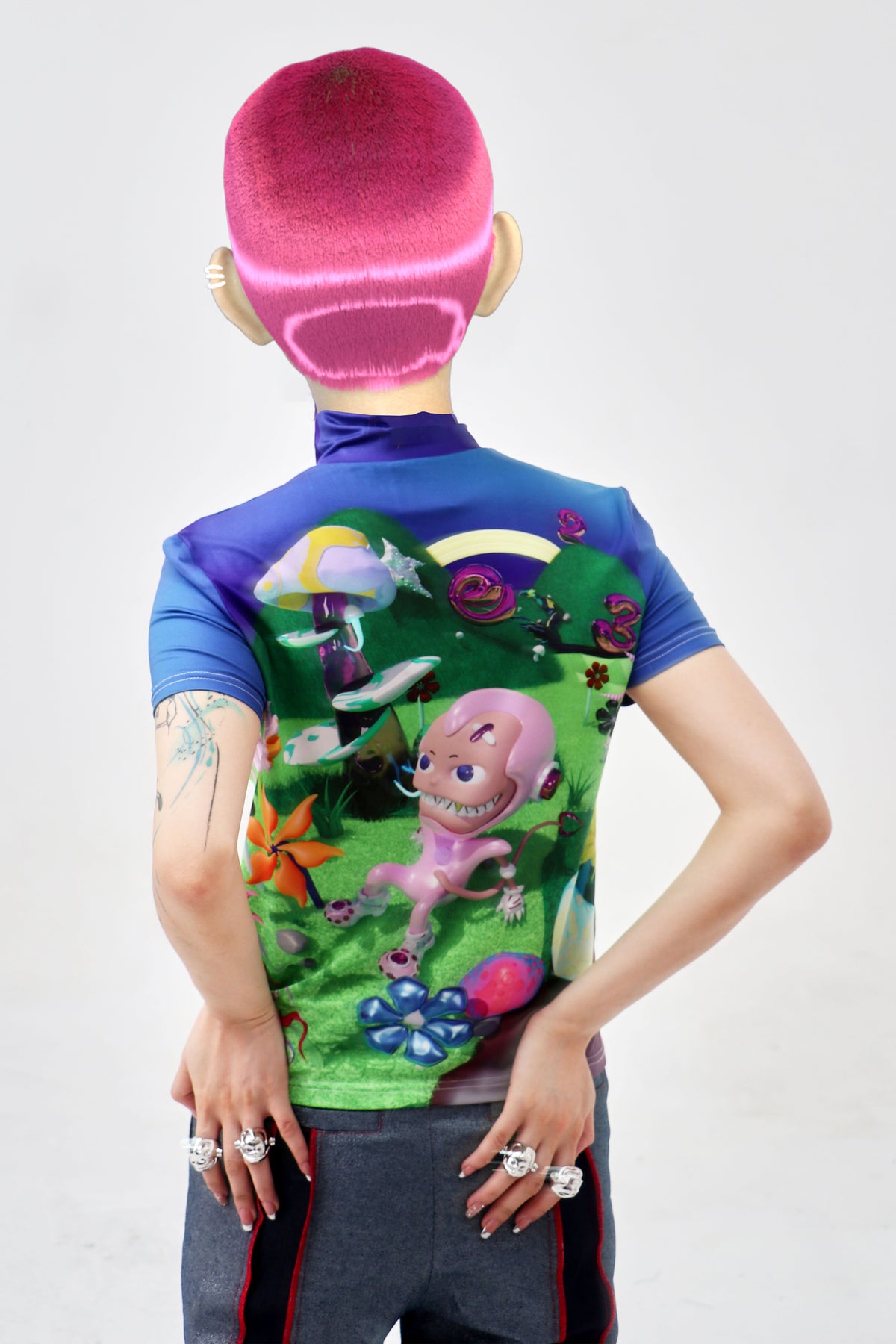 EMBRYO E23 LITTLE ONE printed mock-neck tee in blue multicolor — back modeled close-up with hands on hips