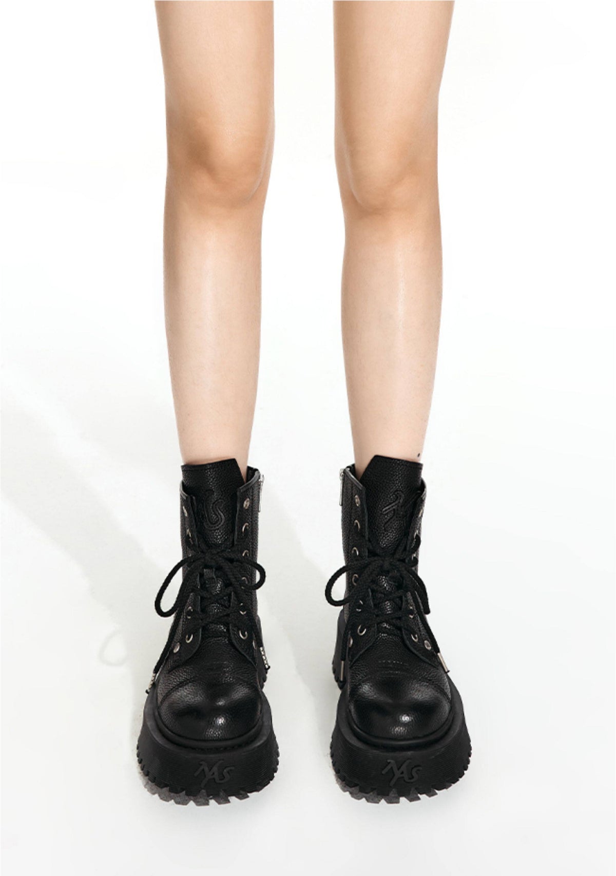NAWS KNIGHT leather platform lace-up boots in MOORE BLACK — front modeled view showing pebbled leather, laces and rounded toes.