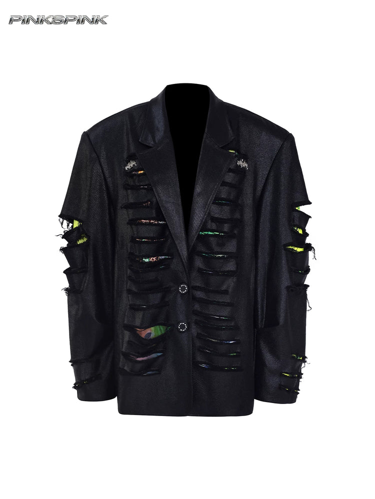 PINKSPINK BREACH distressed coated oversized blazer in black — garment-only front view showing the coated finish and printed fabric beneath the slashes