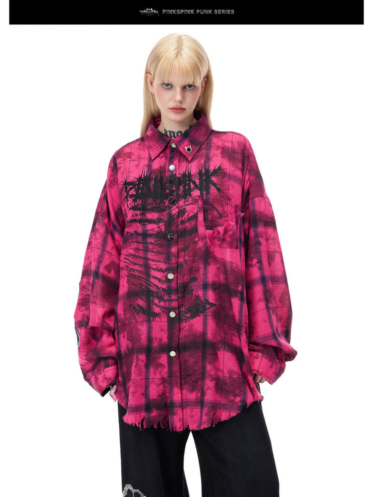 PINKSPINK ELECTRIC MOON distressed oversized plaid shirt in pink and black plaid — close front view showing thorn graphics and frayed pocket