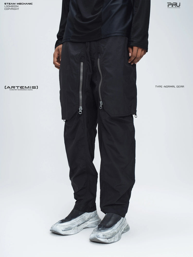 GAIA black curved-blade technical pants — opposite three-quarter front modeled view of the wide legs
