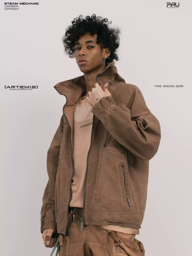 ARTEMIS soft dawn orange tuck-paneled technical jacket — three-quarter modeled close-up with one hand at the collar