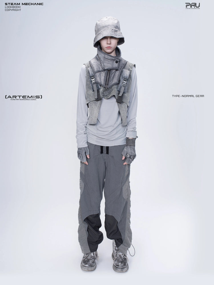ARTEMIS moon dust gray stretch technical base-layer top — front full-length styling view with a separate utility vest and bucket hat
