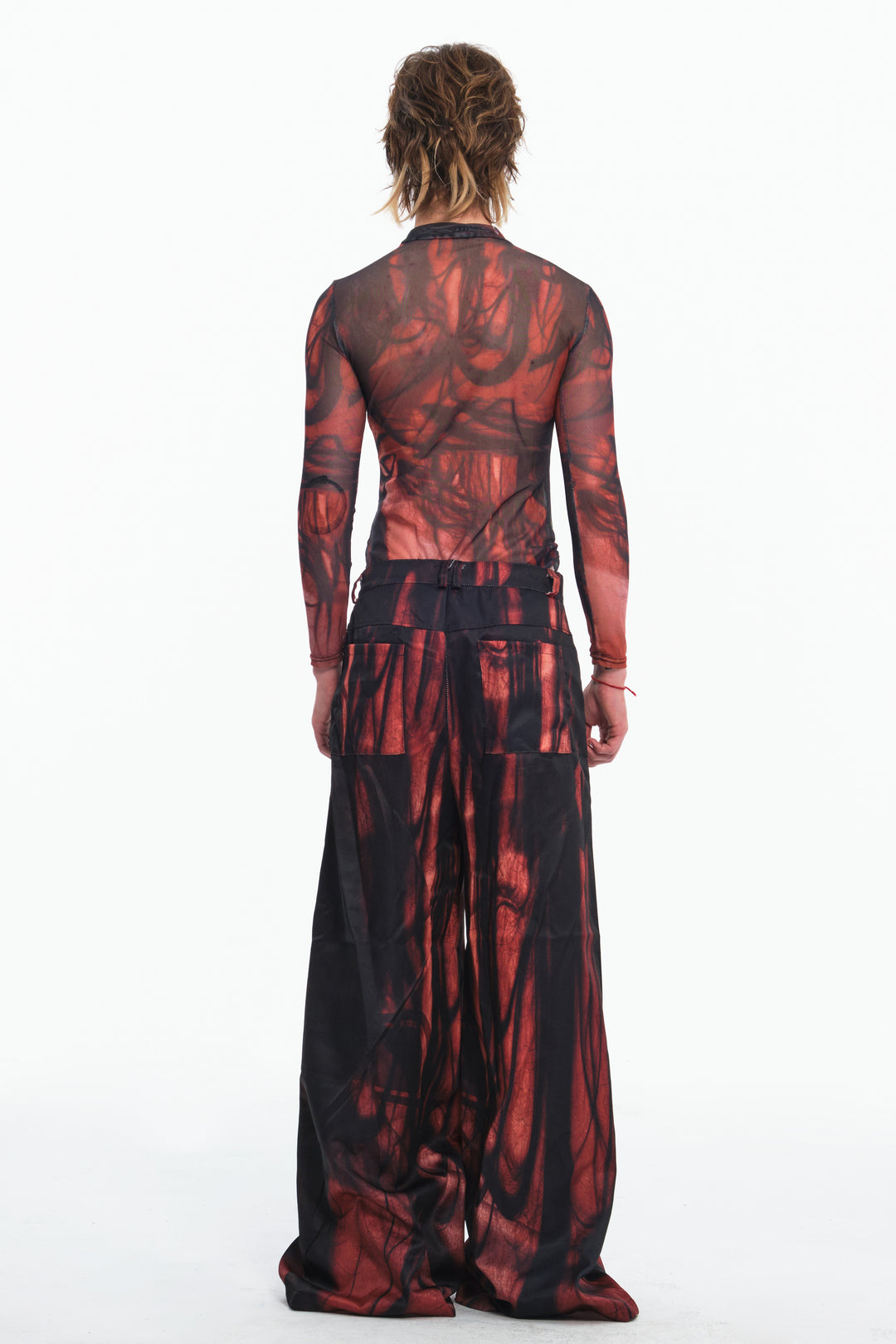 EMBRYO NERVE BLOOM printed flare pants — material and hardware detail
