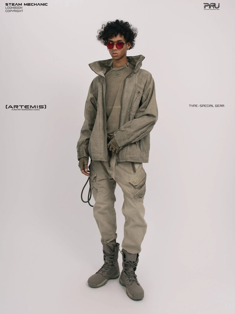 ARTEMIS xirang brown tuck-paneled technical jacket — full-length three-quarter modeled view with the jacket open and one hand at the waist