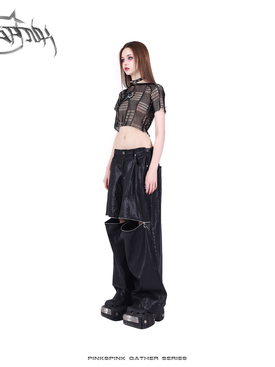 PINKSPINK GEOMETRY open-mesh crop tee in black — side full-length modeled view with coated pants
