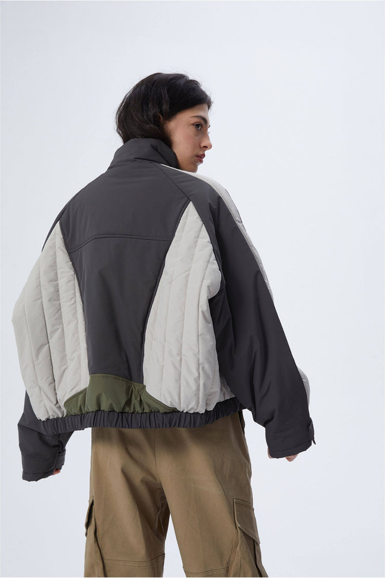 ERRORCODE ROBOT gray, white and green colorblock quilted cropped jacket, rear three-quarter modeled view