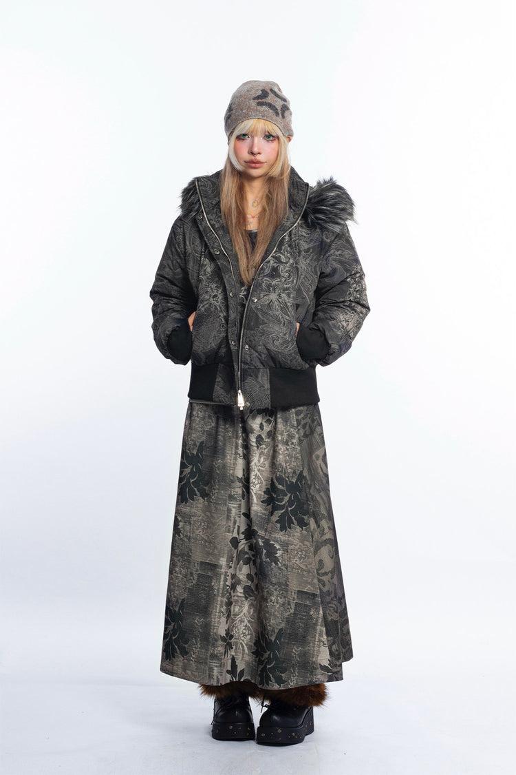 4RE1GN GOTHIC down jacket in charcoal ornamental print — Full-body front view styled with a long skirt and beanie.