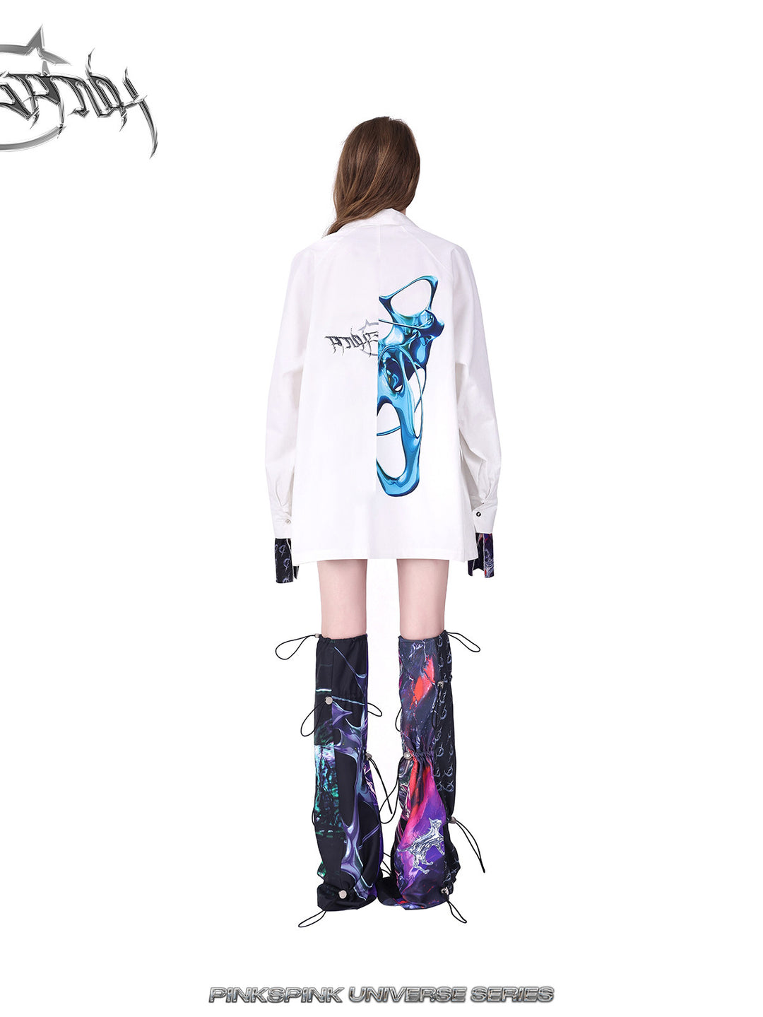 PINKSPINK COSMOS drawcord patchwork leg warmers in black purple multicolor — rear modeled view styled with a white coat