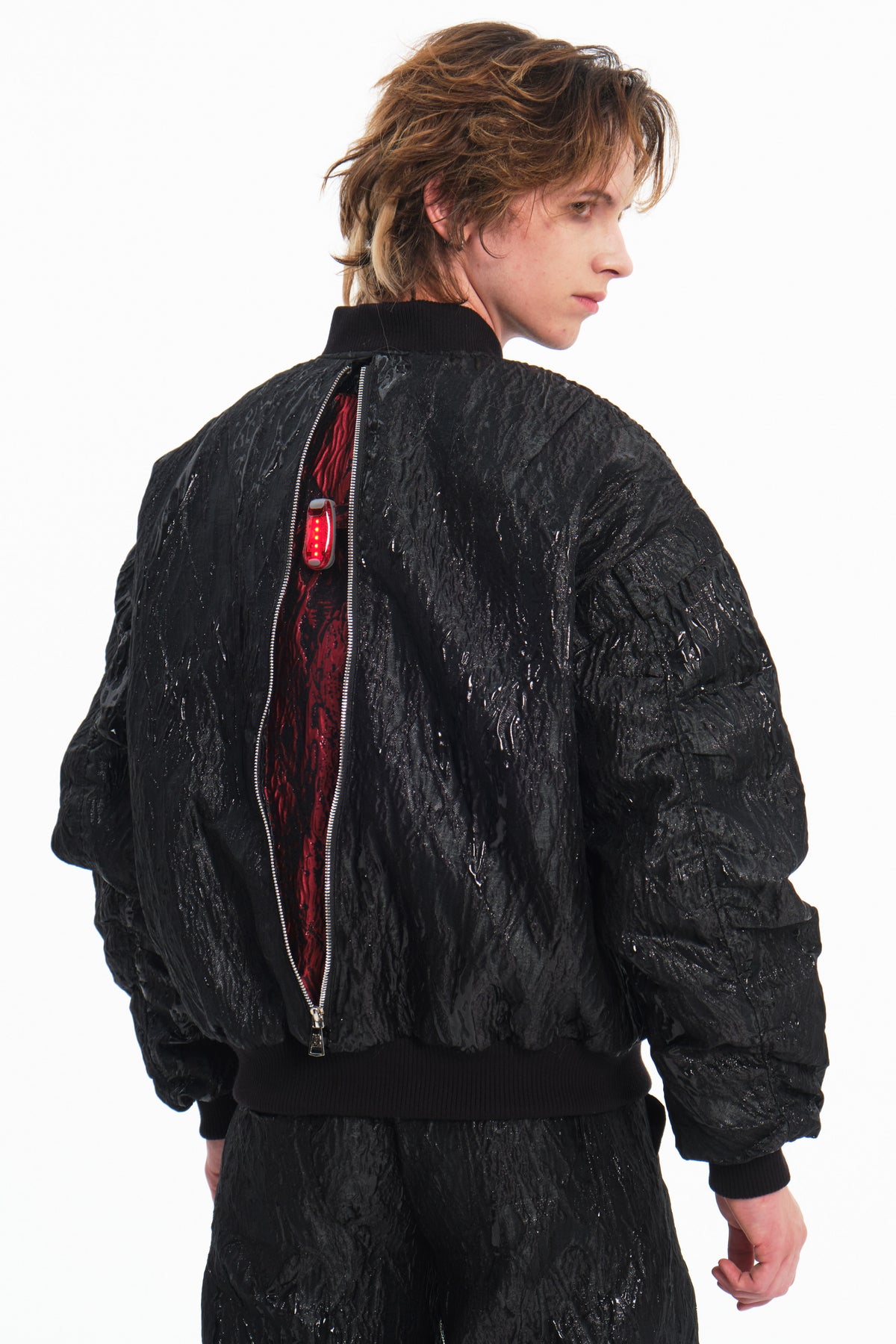 EMBRYO VENOM FLIGHT deconstructed padded jacket — close modeled styling view