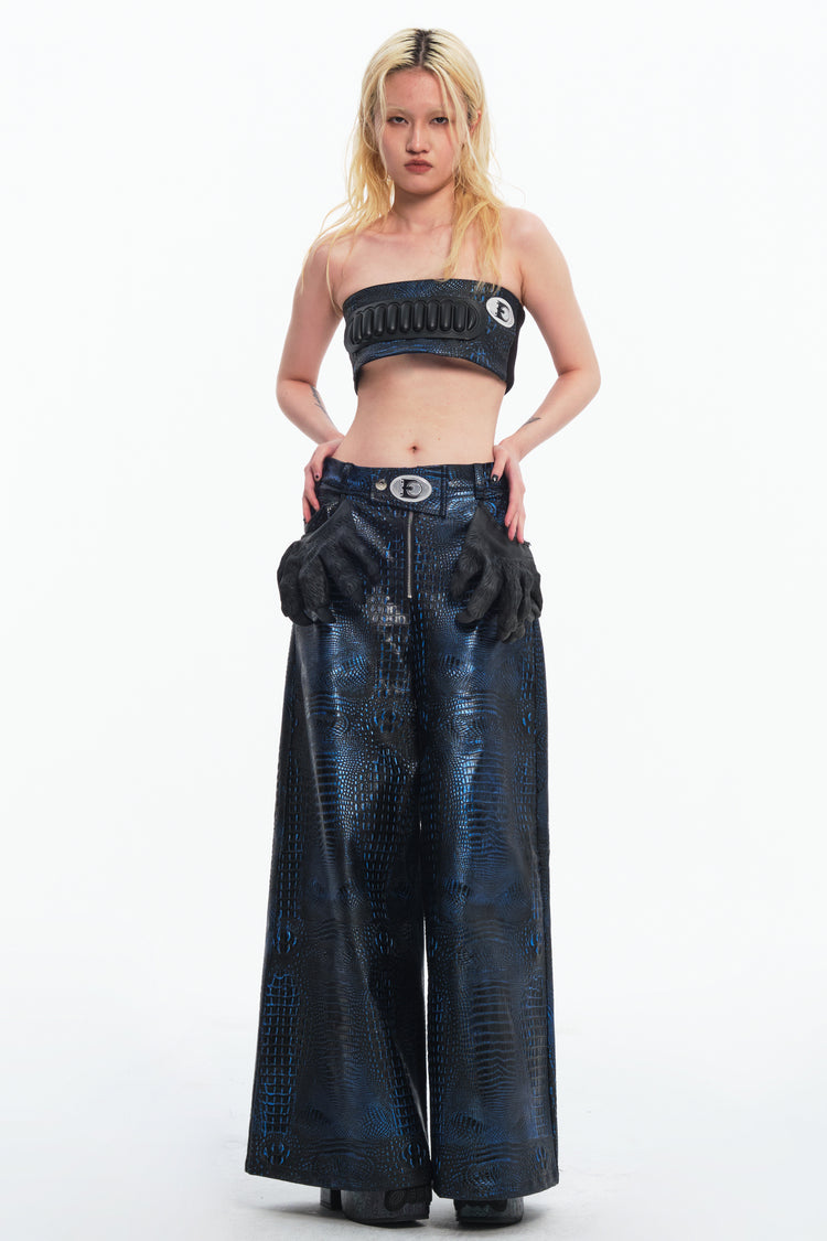 EMBRYO CLAW ARMOR crocodile-effect wide-leg pants — full-length modeled styling view