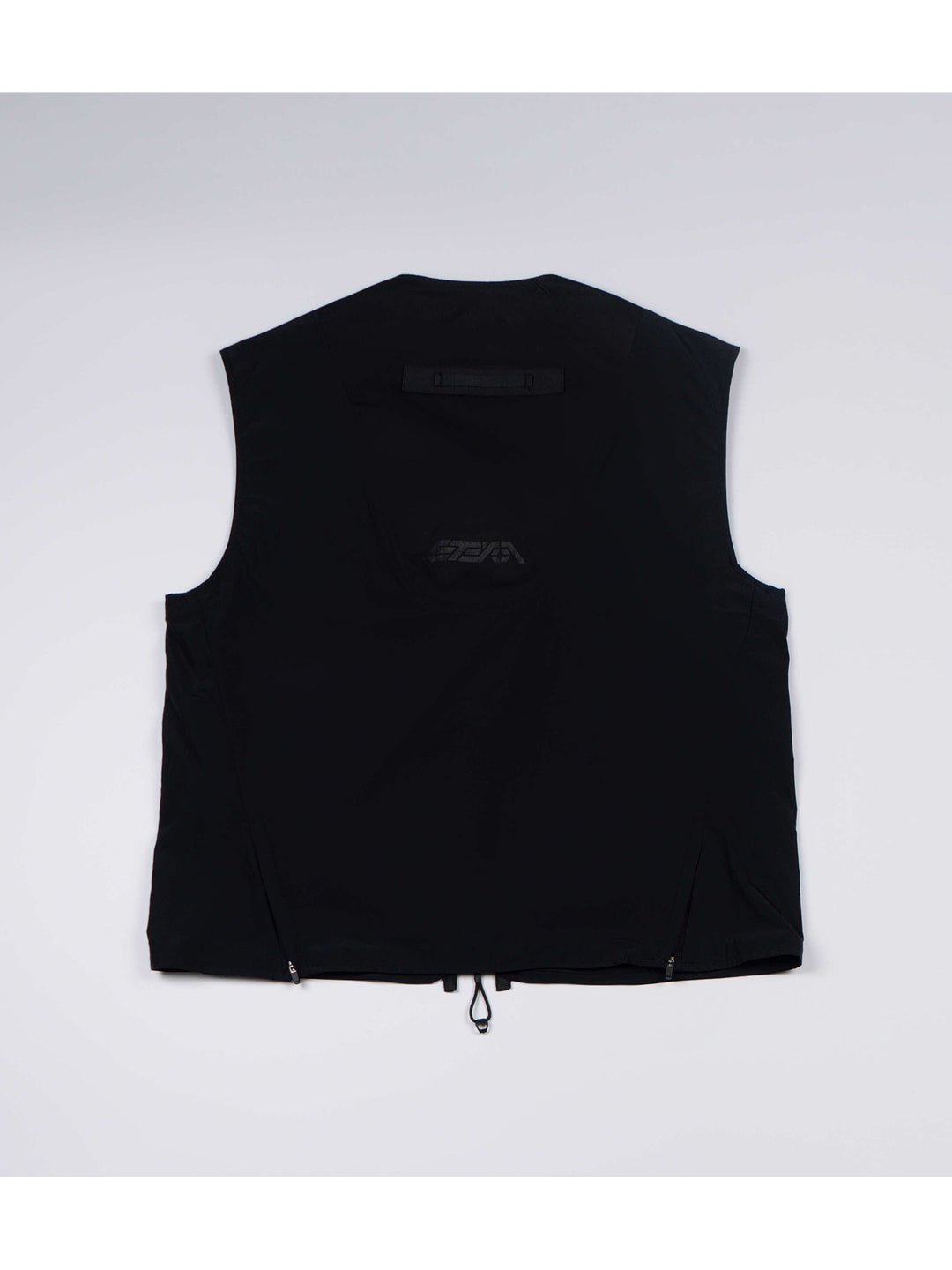 CLERIC utility nylon vest in stardust black — back flat-lay showing the curved logo panel and side zips