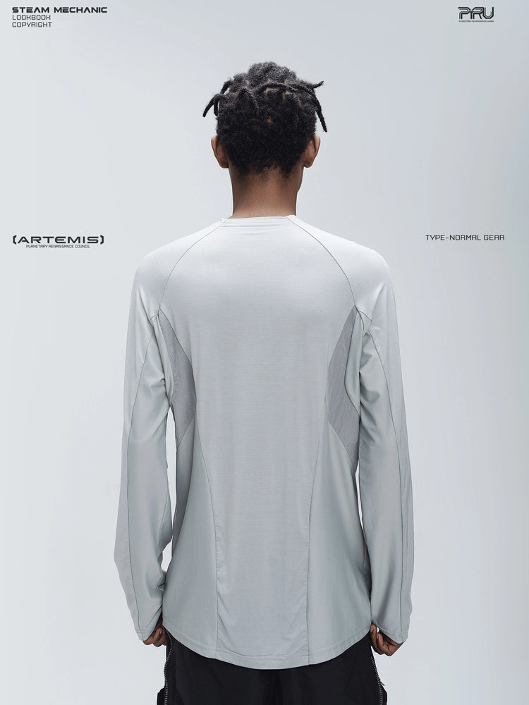 ARTEMIS moon dust gray stretch technical base-layer top — back modeled view showing the raglan seams and straight hem