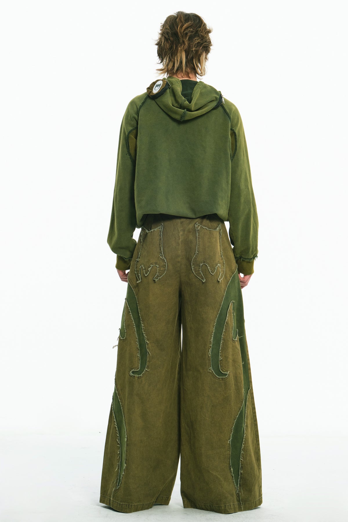 EMBRYO GREEN GUARD distressed wide-leg pants — close modeled view