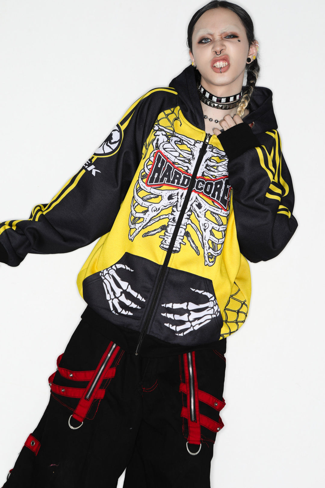 DeadEndKids Hardcore Generation skeleton zip-up hoodie — modeled front, arm-out pose