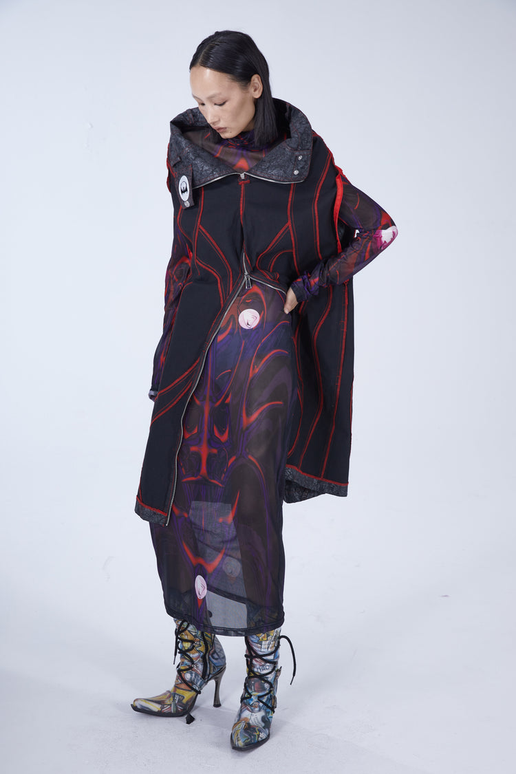 EMBRYO STRUCTURE convertible bustier & wide-leg pants — black reverse long-vest configuration, three-quarter modeled view with unzipped panel