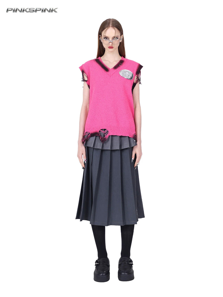 PINKSPINK REBEL distressed ring-detail knit vest in pink — full-length front modeled view over a separate gray pleated maxi skirt