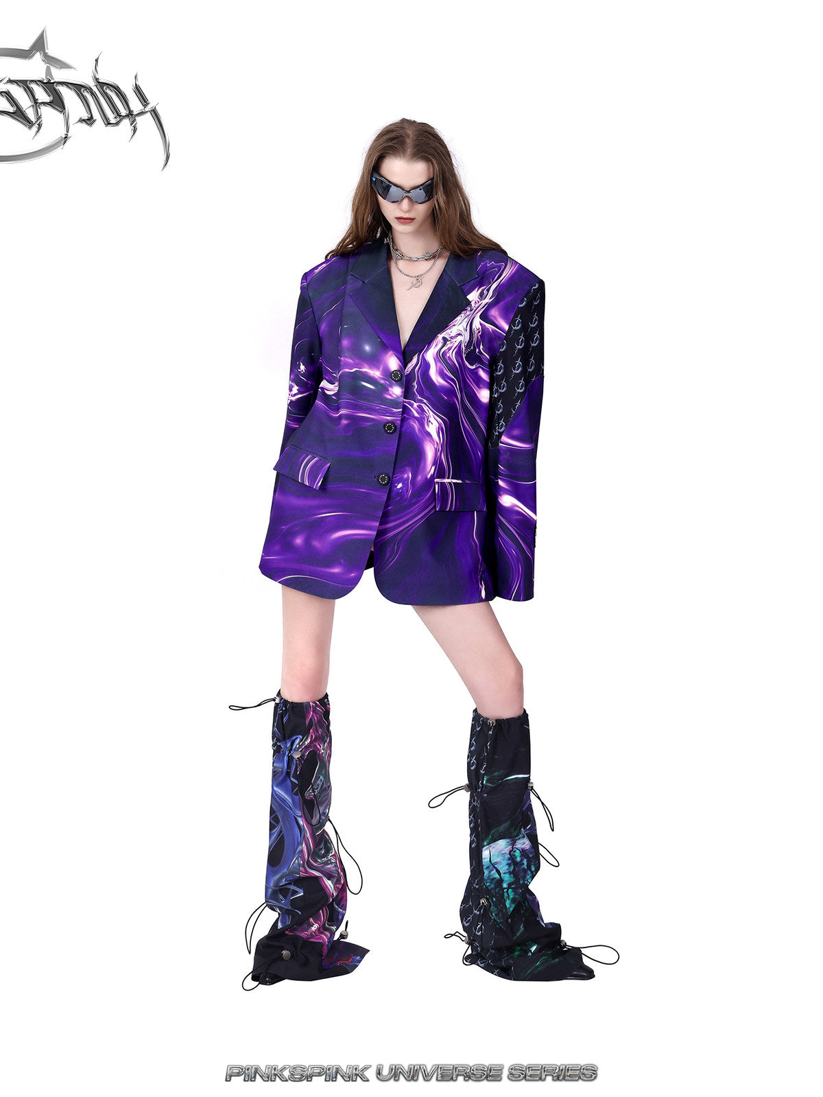 PINKSPINK COSMOS drawcord patchwork leg warmers in black purple multicolor — angled front modeled view styled with a purple blazer