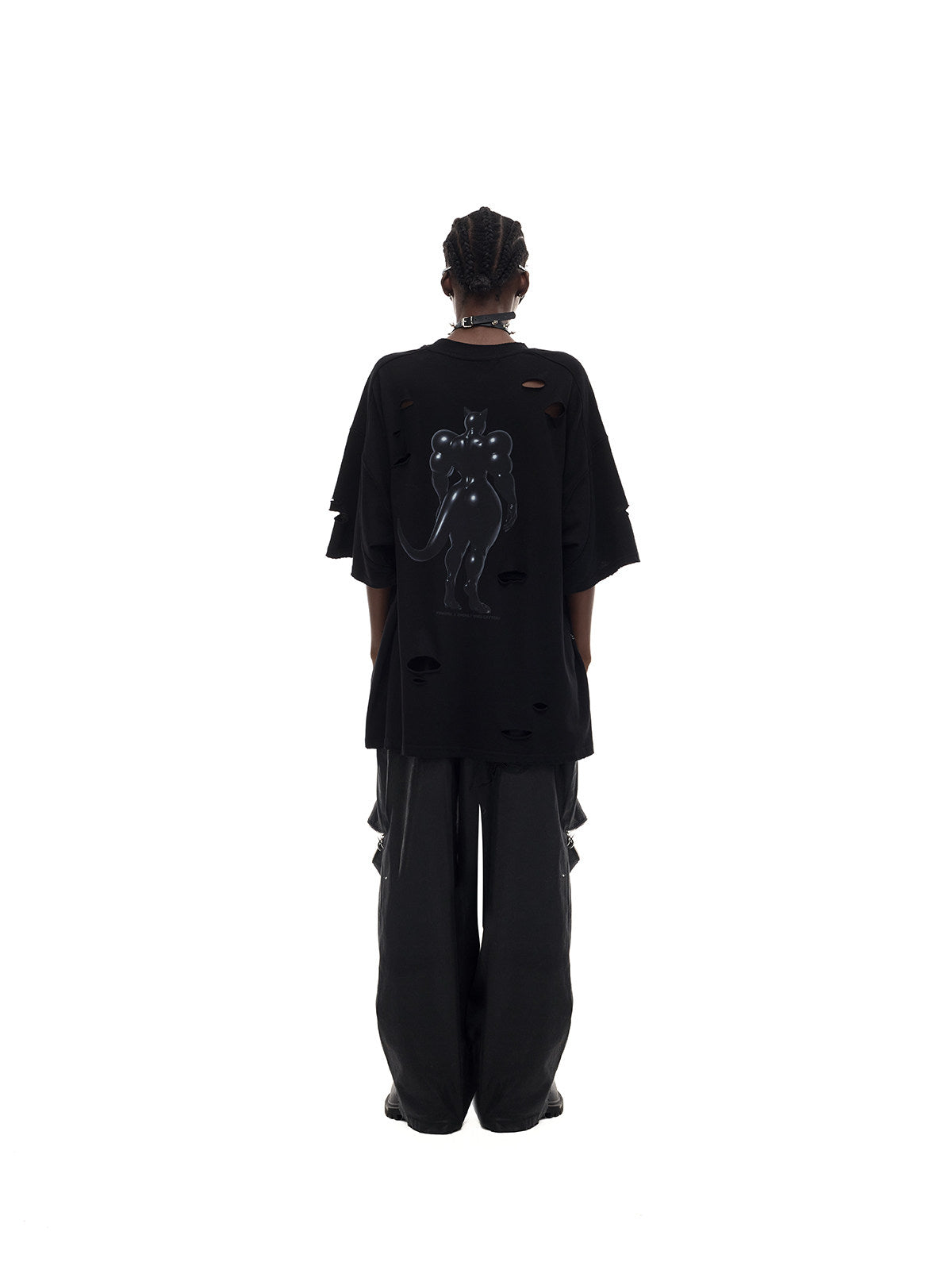 PINKSPINK FUTURE CAT distressed oversized tee in black — rear full-length modeled view styled loosely with trousers