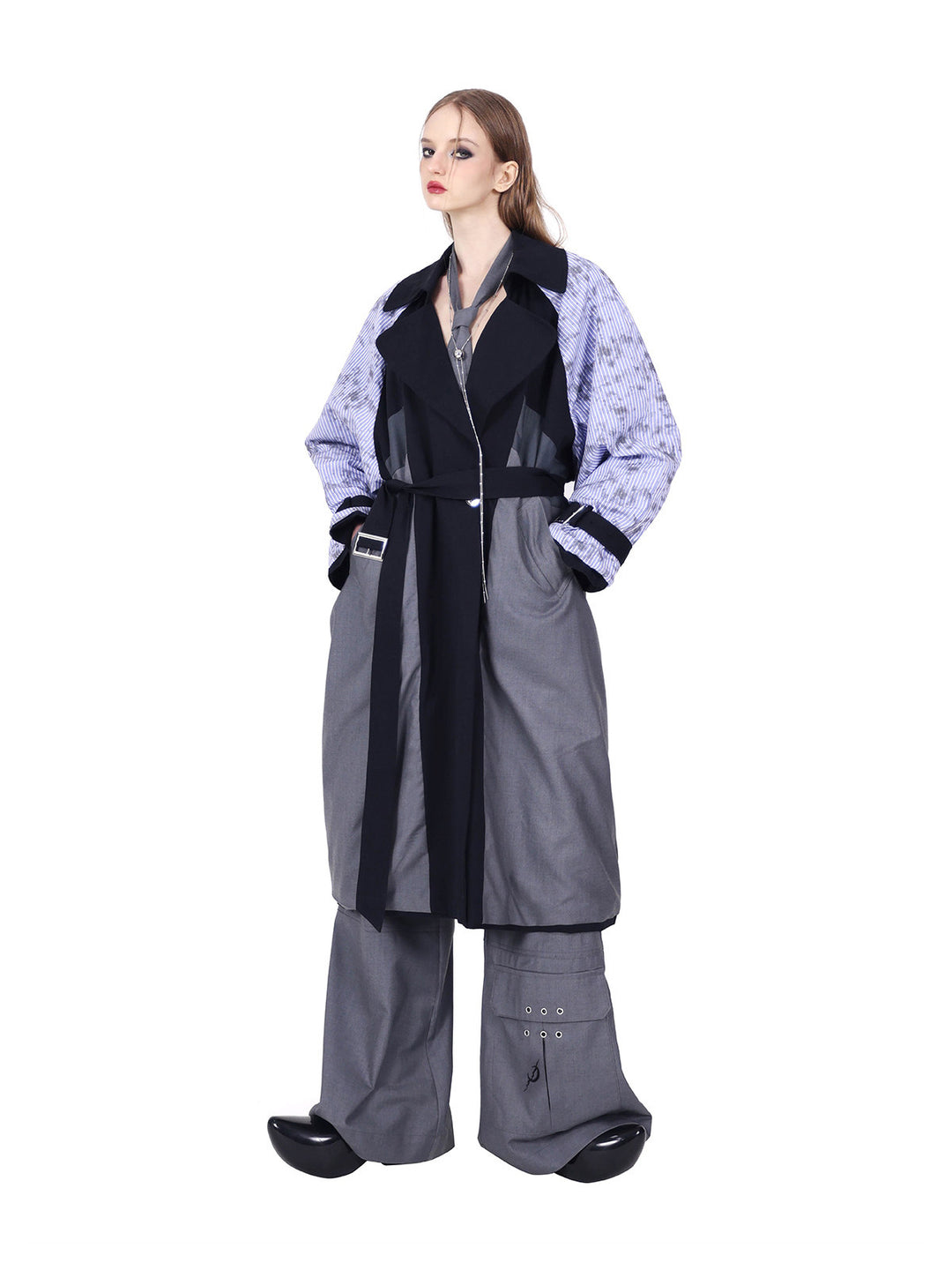 PINKSPINK ELECTRIC MOON reversible patchwork trench coat in black and gray — belted reverse with hands in pockets, corresponding to the hero collage