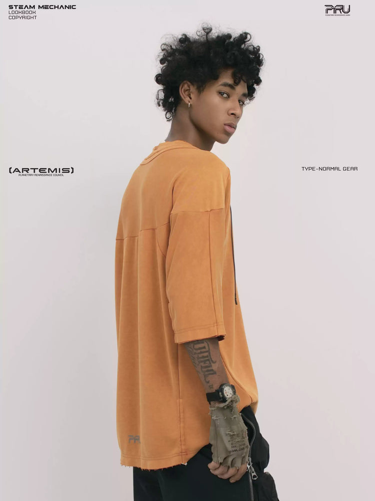 LIGHTSHADOW eclipse orange deconstructed technical tee — side three-quarter view showing sleeve panels