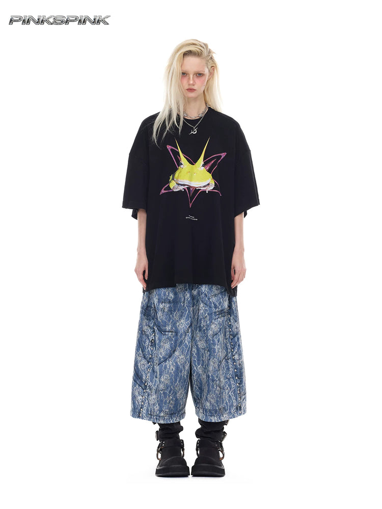 PINKSPINK ELECTRIC MOON lace-coated wide-leg denim shorts in blue — full-length front modeled view with an oversized graphic tee