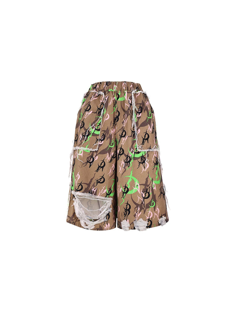 PINKSPINK ELECTRIC MOON distressed camo cropped trousers in CAMOUFLAGE — garment-only front.