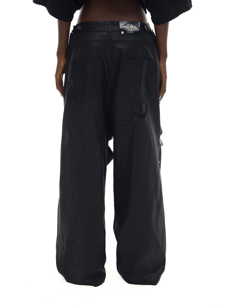 PINKSPINK ELECTRIC MOON coated zip-knee wide-leg pants in black — rear waist-to-hem modeled view showing the pockets