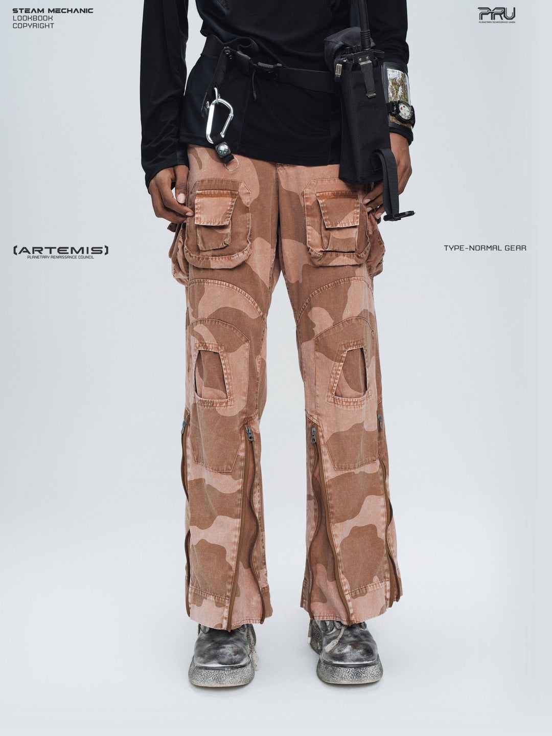 IXION washed camouflage combat pants in dune red — front close modeled view showing the paired cargo pockets and open knee panels