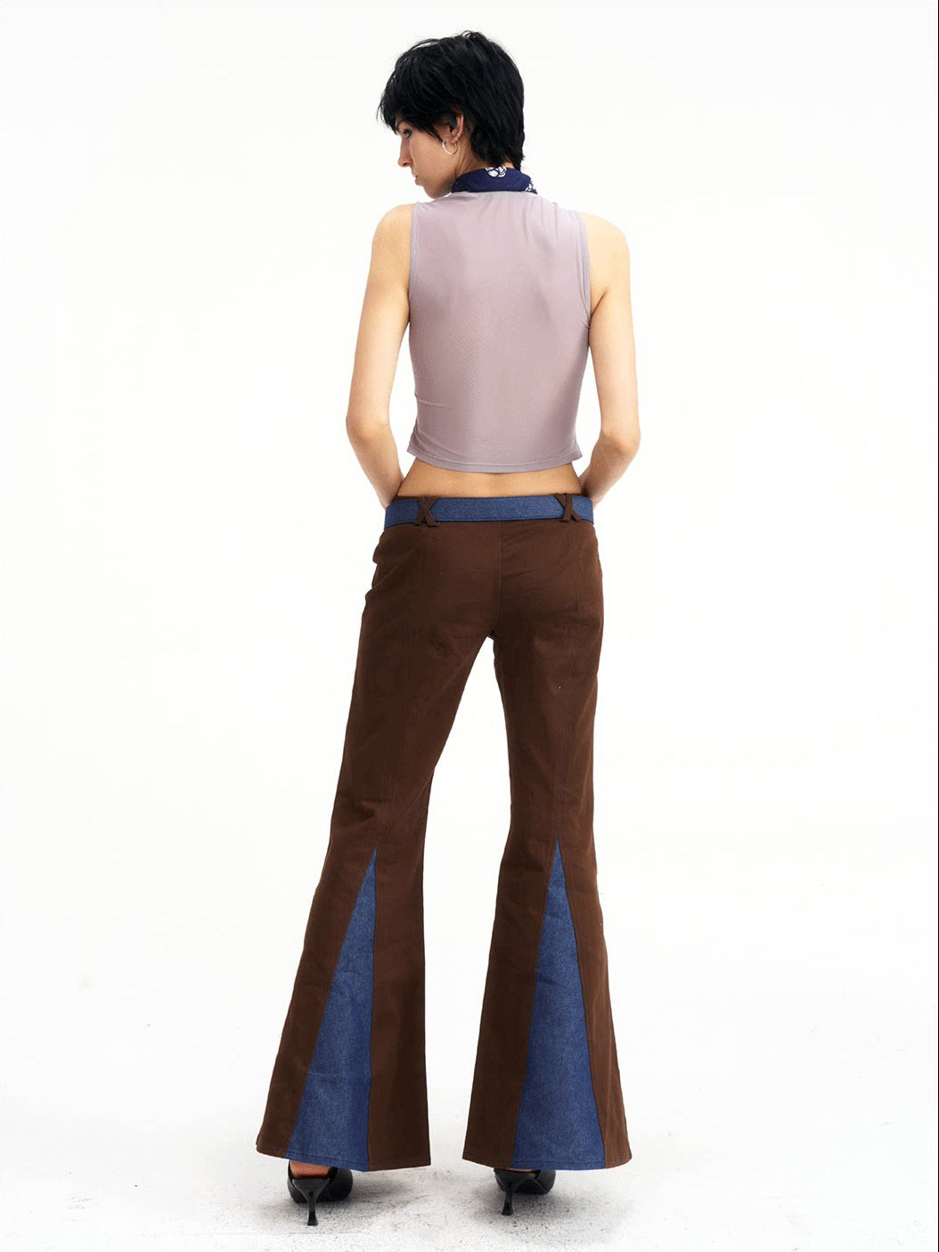 NEXT PASSPORT denim-panel low-rise flared pants in brown — full-length direct back view.