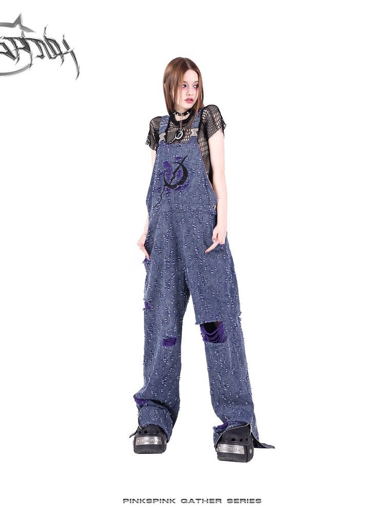 PINKSPINK BROKEN VIOLET distressed denim overalls — close modeled view highlighting the construction