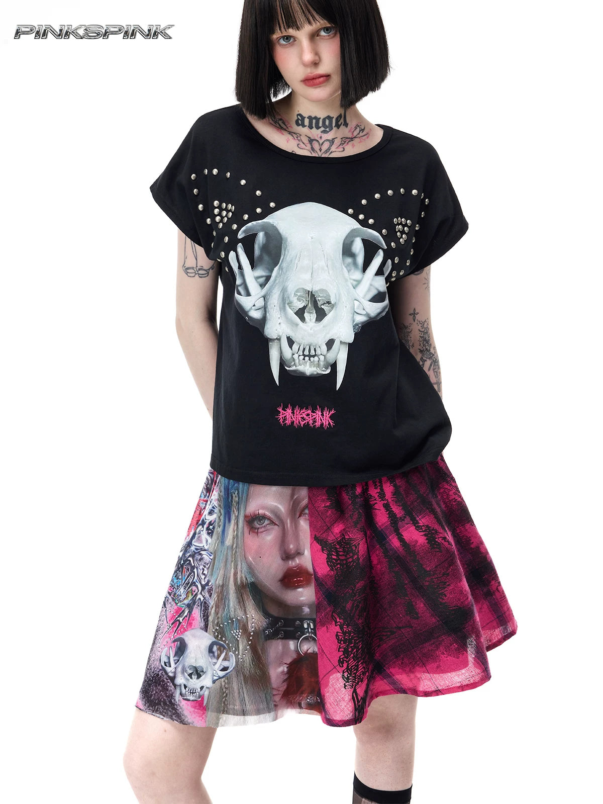 PINKSPINK FUTURE PORTRAIT reversible graphic mini skirt in black and pink — close front modeled view showing the portrait panel beneath a separate black graphic tee