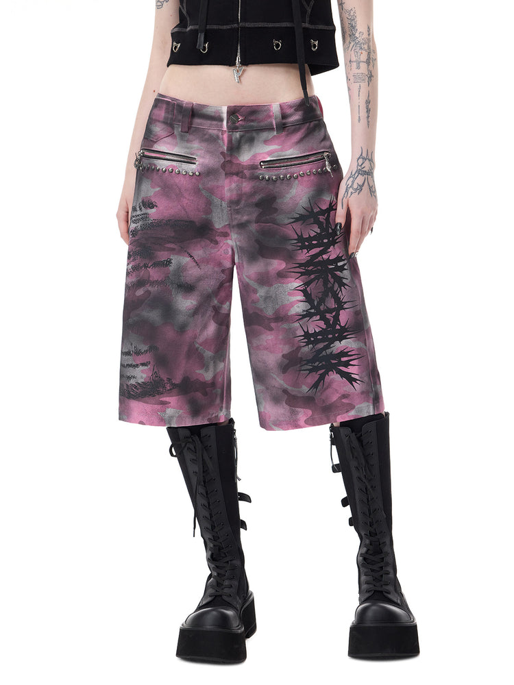 PINKSPINK ELECTRIC MOON coated camouflage denim shorts in pink-gray camouflage — front waist-to-hem view showing the wide cut