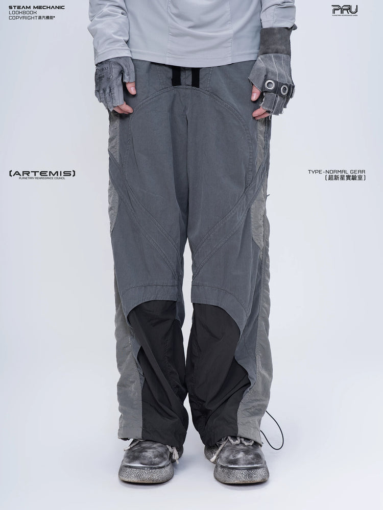 SUPERNOVA alloy gray metallic nylon technical pants — front modeled product view