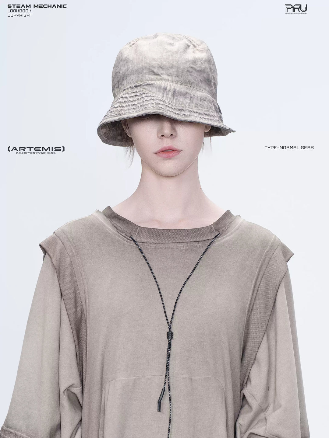 PIONEER mercury brown distressed nylon bucket hat — front portrait showing the distressed bucket crown and stitched brim
