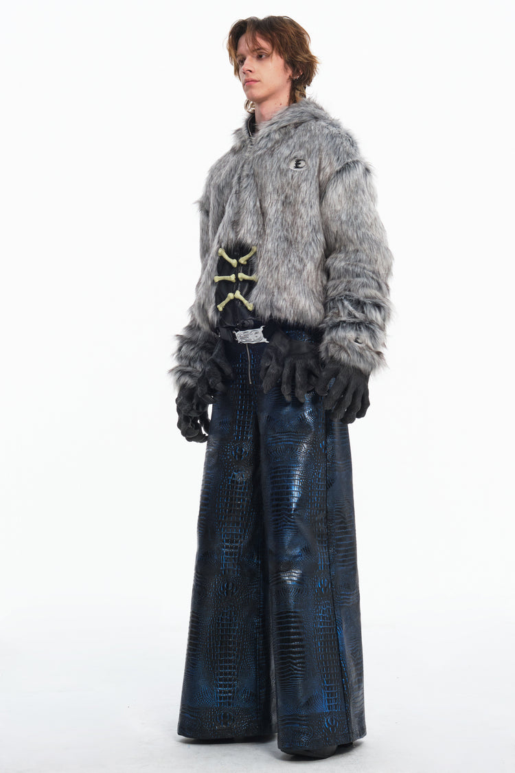 EMBRYO CLAW ARMOR crocodile-effect wide-leg pants — construction and silhouette detail