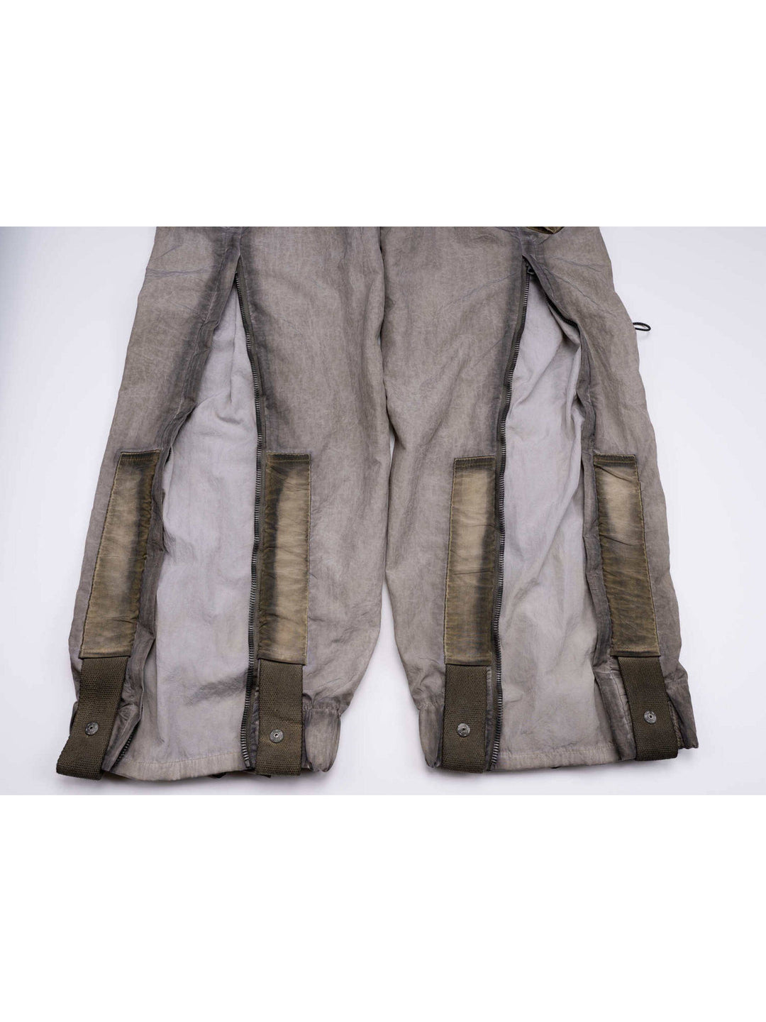 STARCORE mercury brown engineer utility pants — back lower-leg zipper expansion panels close-up