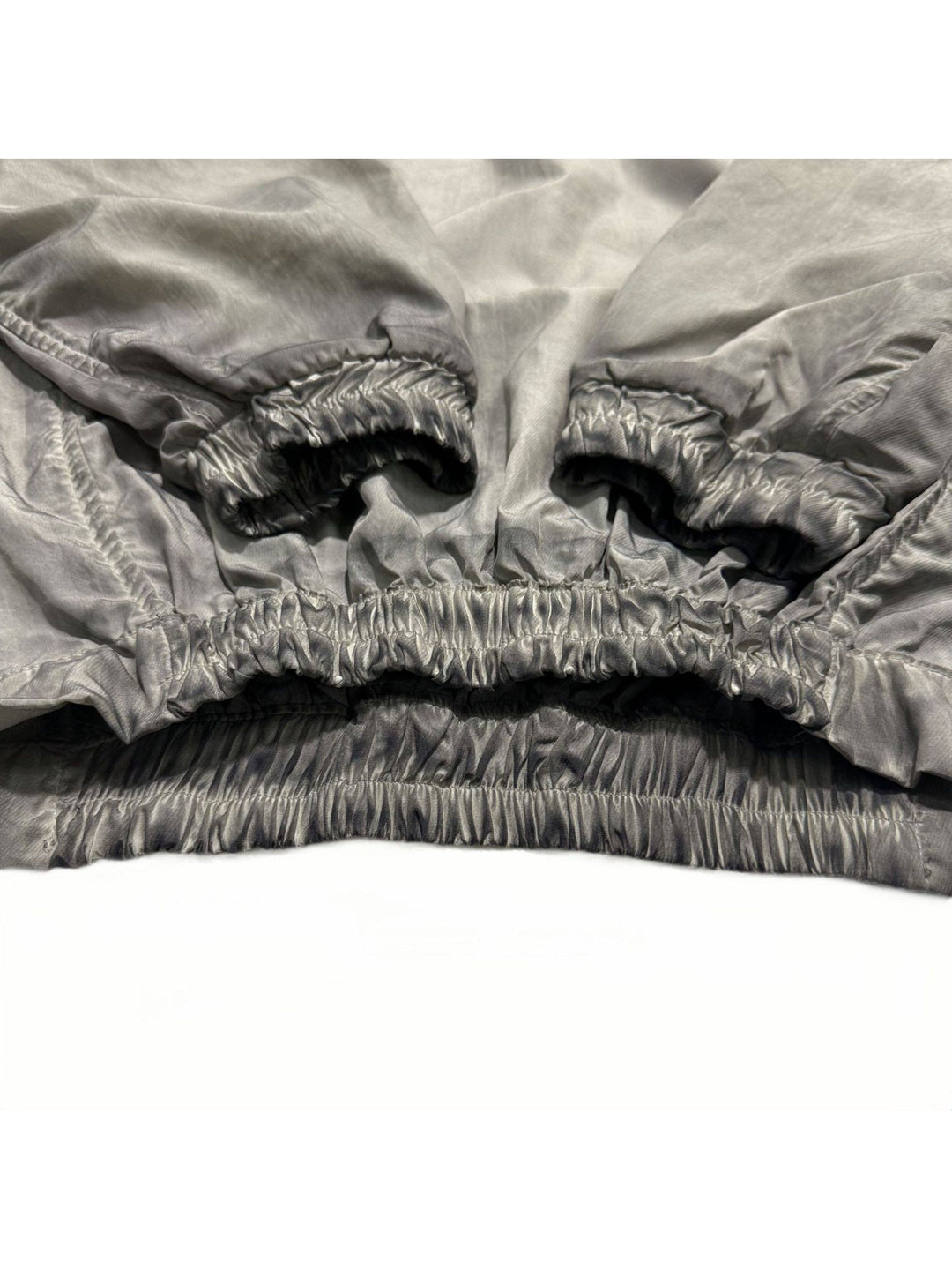 PIONEER meteorite-gray mesh hoodie — close-up of the gathered cuffs and elasticated hem